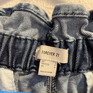 Forever 21 (Size Small) High wasted Stretch jeans. Pockets on sides. Draw string